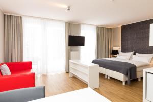 Łóżko lub łóżka w pokoju w obiekcie Amedia Luxury Suites Graz, Trademark Collection by Wyndham
