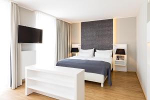 Łóżko lub łóżka w pokoju w obiekcie Amedia Luxury Suites Graz, Trademark Collection by Wyndham