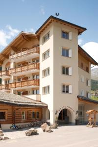 a large apartment building with a balcony at Alpenhof in Davos