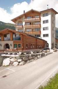 
a large stone building with a view of the ocean at Alpenhof in Davos

