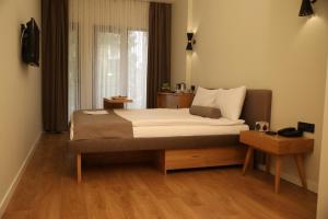 מיטה או מיטות בחדר ב-Roomers Nisantasi