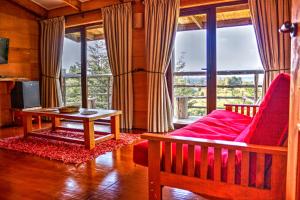 a living room with a couch and a table at Hotel Parque Quilquico in Quilquico