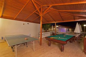 a room with two ping pong tables in a building at Sunny Hill Alya Hotel in Alanya