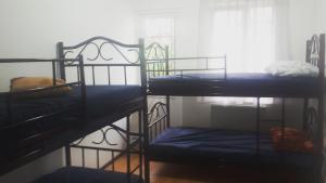 Postel nebo postele na pokoji v ubytování Enjoy The Hostel