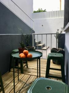 a table with oranges on it on a balcony at The Minimal House II in Bombarral