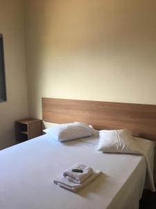 Postel nebo postele na pokoji v ubytování Hotel Paulista + 19 fotografií