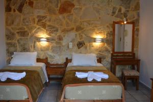 A bed or beds in a room at Villa Giorgos