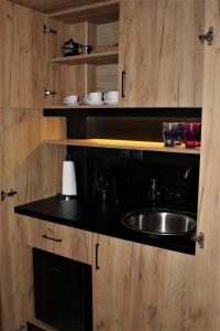 a kitchen with a sink and a counter at Dali Rooms in Chania Town