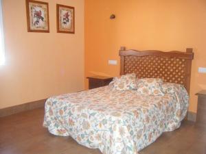 Posteľ alebo postele v izbe v ubytovaní Hostal Muriel