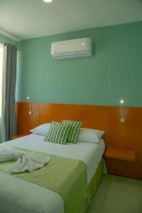 Postel nebo postele na pokoji v ubytování Relax Inn Suites