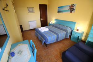 A bed or beds in a room at B&B Villa Rosa