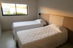 Cama ou camas em um quarto em Iguassu Express Hotel