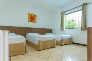 Postel nebo postele na pokoji v ubytování Hotel Holiday Foz