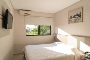 Cama ou camas em um quarto em Iguassu Express Hotel