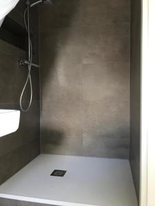 a bathroom with a shower with a sink and a shower at Hotel Maxdorfer Hof in Maxdorf