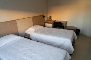 Cama ou camas em um quarto em Iguassu Express Hotel