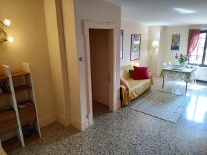 a living room with a couch and a table at Apartment in Molino Stucky in Venice