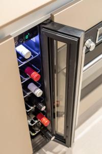a drawer with wine bottles in a kitchen cabinet at Park Residence in Split