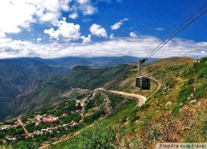 a gondola ride on a mountain with a road at Syunyats guest house in Halidzor