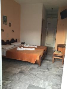Postel nebo postele na pokoji v ubytování Anatoli Beach Hotel