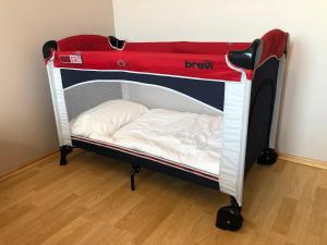 a red and white bunk bed in a room at Apartment near centre in Tartu