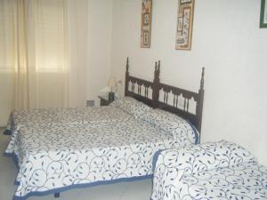 Posteľ alebo postele v izbe v ubytovaní Hostal Muriel