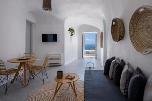 a living room with a couch and a table at Delilah Villa by Senses Collection in Pyrgos