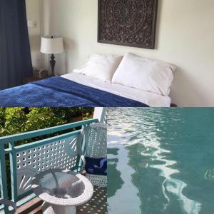 a hotel room with a bed and a swimming pool at Ella's Park View Townhouse Crown Point in Crown Point +42 photos