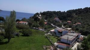 an aerial view of a small village with a house at Vontzos Hotel in Achladies