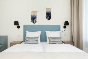 Łóżko lub łóżka w pokoju w obiekcie Aquamarina Onyx Marina Invest