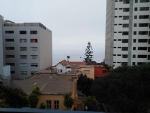 a view of a city with buildings and a house at MLA apartments - Buenos Aires in Lima