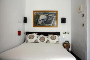 Posteľ alebo postele v izbe v ubytovaní Hostal Extramuros