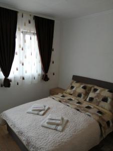 Postel nebo postele na pokoji v ubytování Studio apartman Olivera