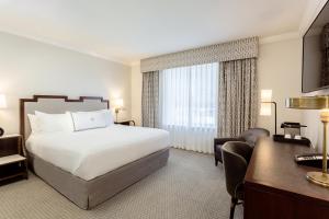 Voodi või voodid majutusasutuse The Lancaster Hotel toas