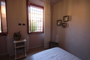 A bed or beds in a room at A due passi dal Castello