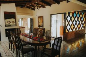 a dining room with a table and chairs at Rancho el Parral in San Marcos