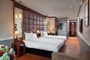 En eller flere senge i et værelse på Classy Holiday Hotel & Spa