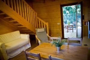 a living room with a couch and a table at Apartamentos el Bosquet in Sant Cugat del Vallès