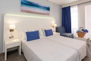 Postel nebo postele na pokoji v ubytování Hostal Pitiusa