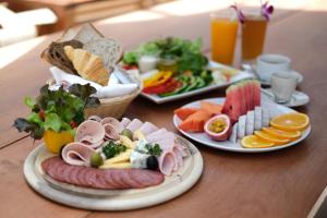two plates of food on a table with plates of food at Banana Fan Sea Resort in Chaweng