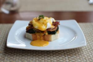 a sandwich on a white plate on a table at Banana Fan Sea Resort in Chaweng