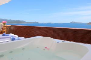 a bath tub on the balcony of a cruise ship at Lycia Hotel in Kaş