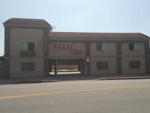 a building with a garage with a fire truck at Regal Inn in Los Angeles