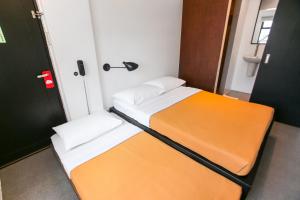 Postel nebo postele na pokoji v ubytování Gomez House
