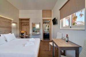 Posteľ alebo postele v izbe v ubytovaní Emmanouela's Apts