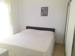 Postel nebo postele na pokoji v ubytování Apartmani Ivan by the sea