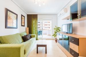 TV a/nebo společenská místnost v ubytování Apartamentos Jardines del Mar II