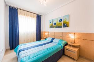Postel nebo postele na pokoji v ubytování Apartamentos Jardines del Mar II
