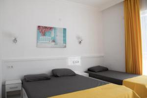 Postel nebo postele na pokoji v ubytování Aroma Butik Hotel