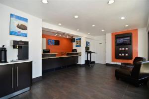 a lobby of a barber shop with a waiting room at Motel 6-Fairfield, CA - Napa Valley in Fairfield